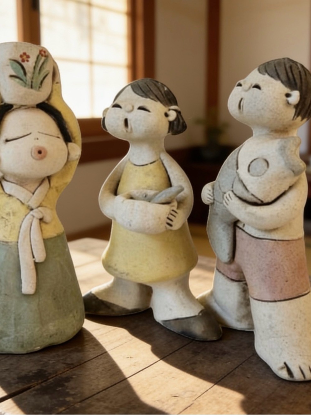 Handcrafted Ceramic Boy Figurine Holding Fish - Neutral Tones